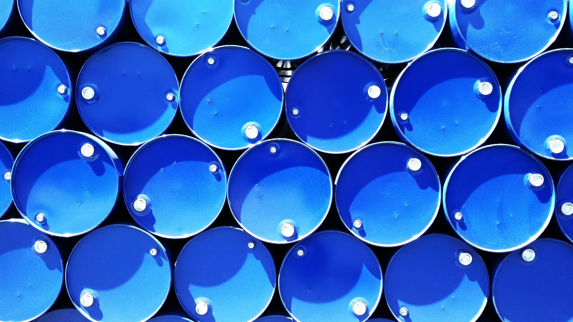 Rows of industrial drums representing recoverable surplus materials